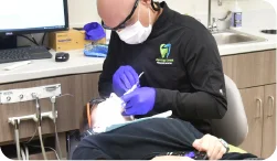 Dr Kennedy working on a patients smile