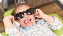 Young girl smiling with healthy teeth.