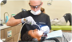 A young boy is treated by Dr. Kennedy.