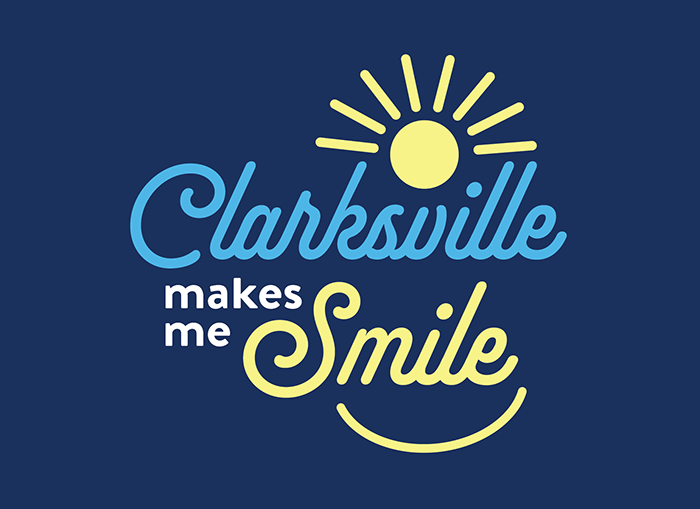 Tagline design that reads "Clarksville makes me Smile" with a sun and smile design surrounding the words.